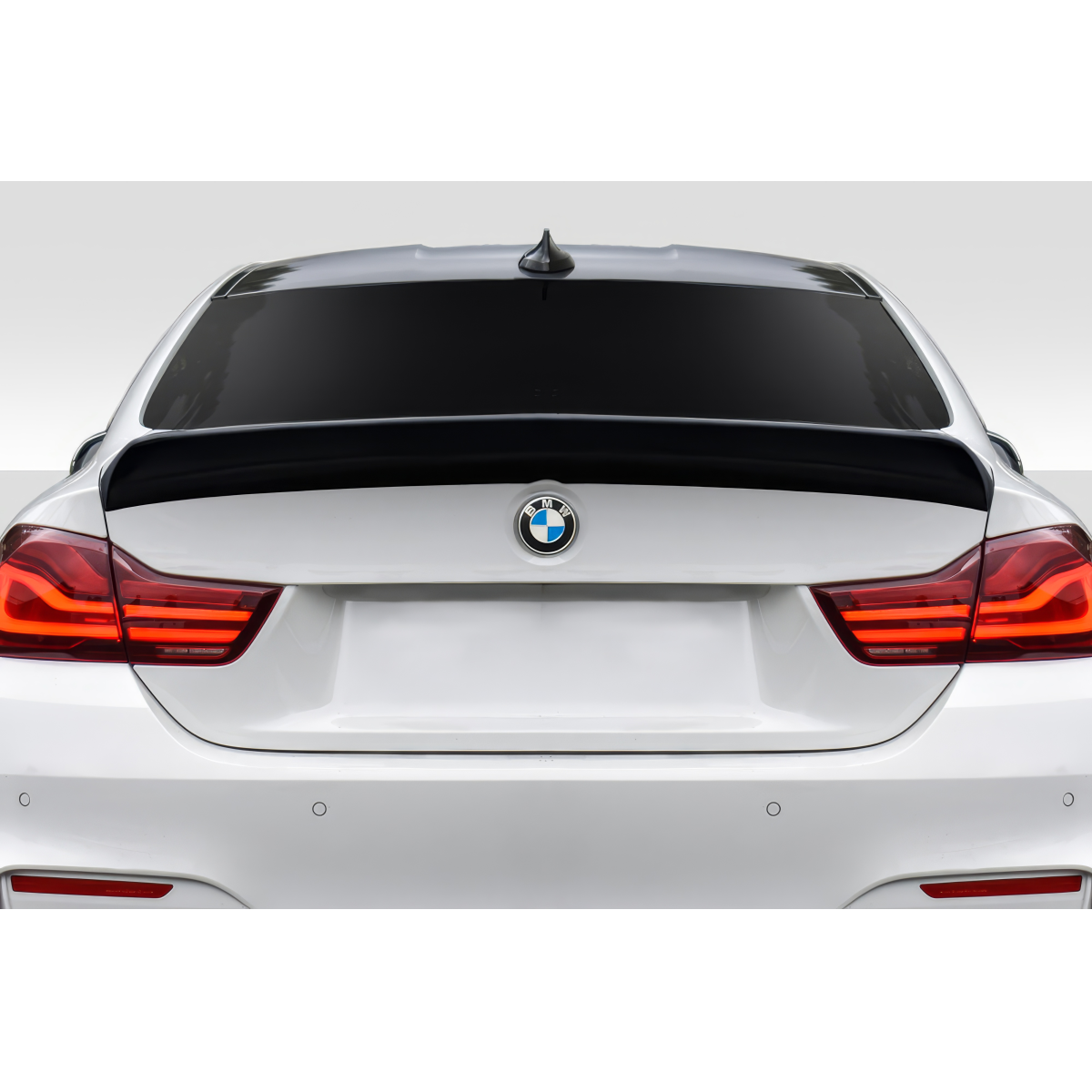 Modify your BMW M4 2015 with our Exterior/Wings - Rear view angle of the car showing the spoiler