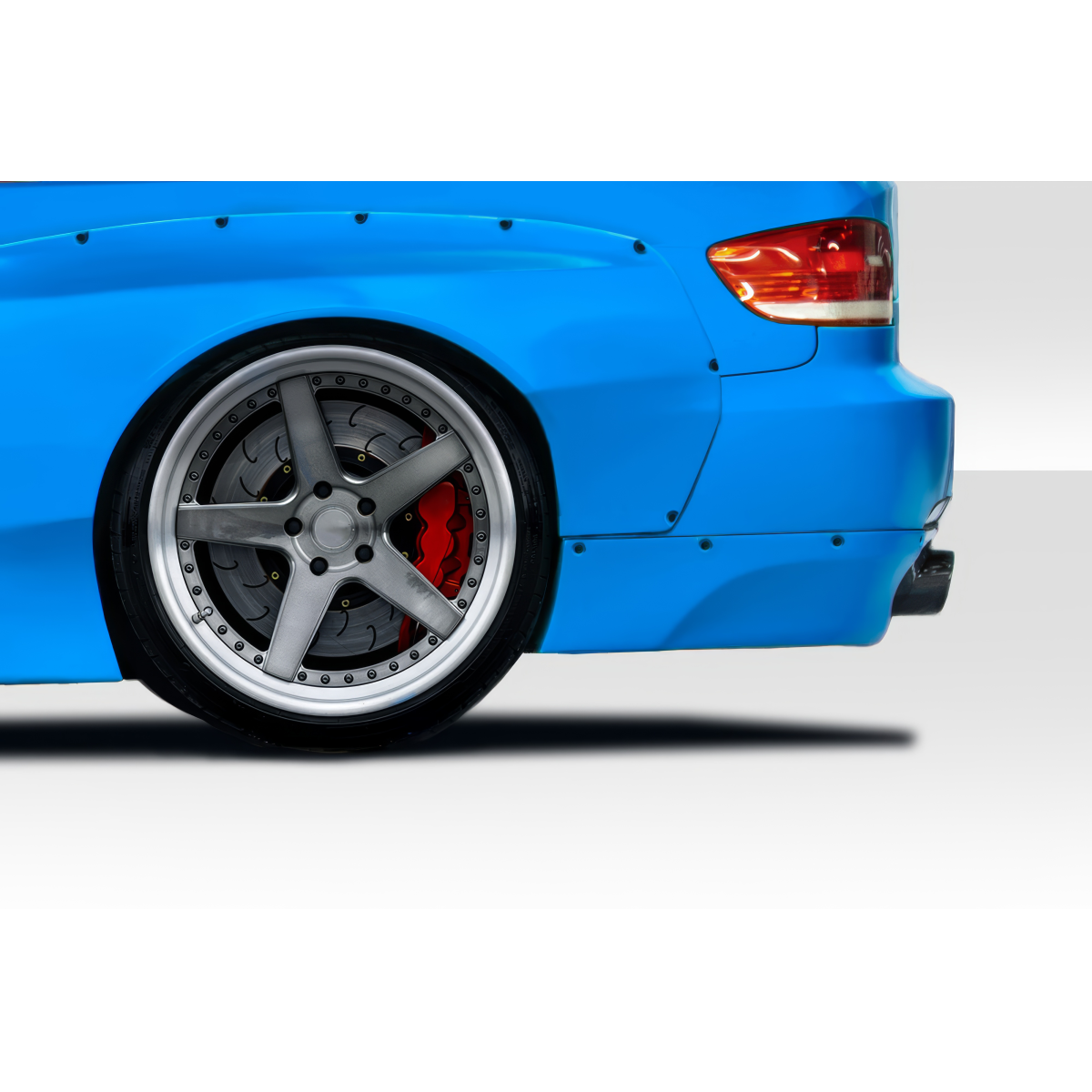 Modify your BMW 3-Series 2007 with our Exterior/Rear Bumpers or Lips - Rear angle view of blue BMW 3 Series