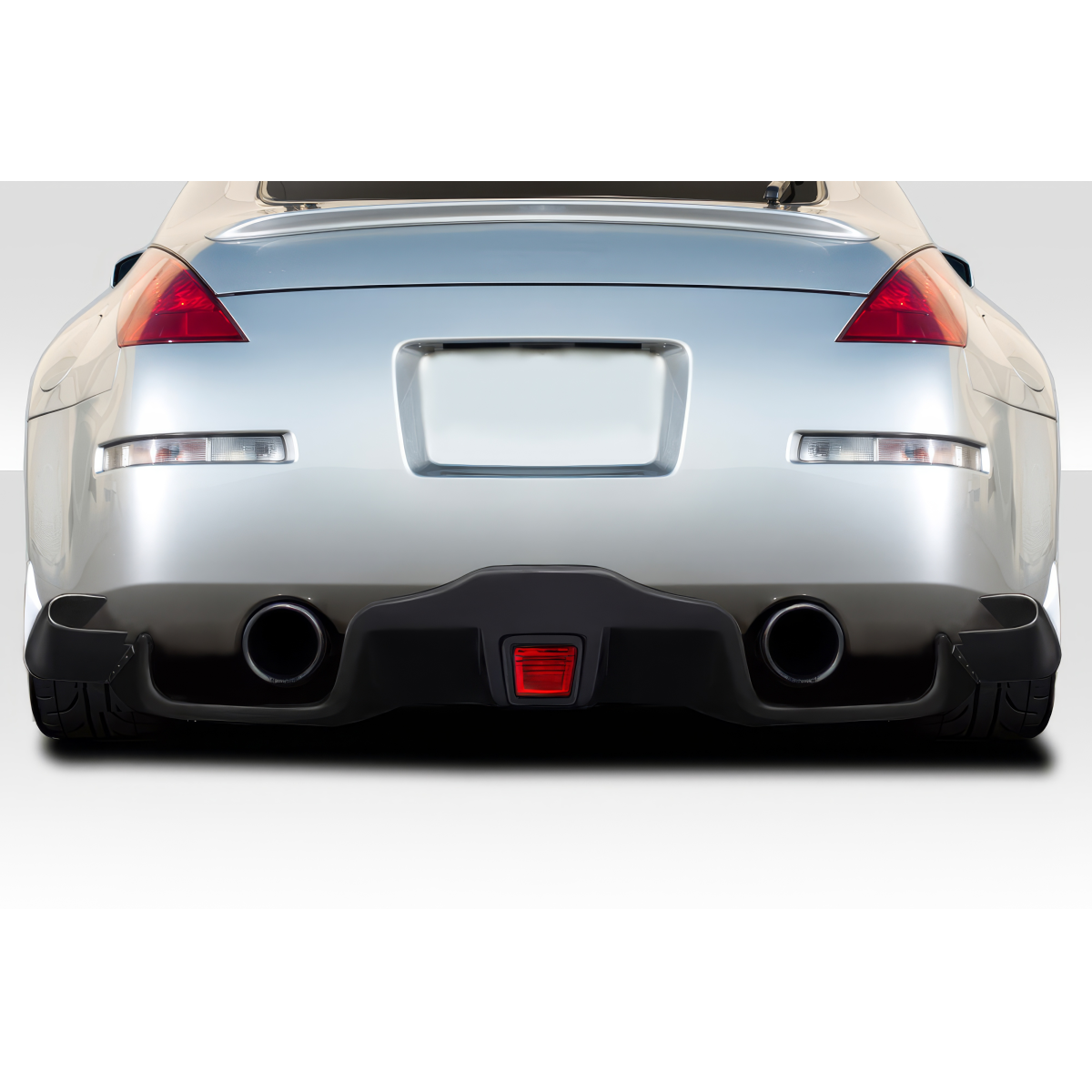 Modify your Infiniti G35 2003 with our Exterior/Diffusers - Rear view at a low angle showcasing diffusers