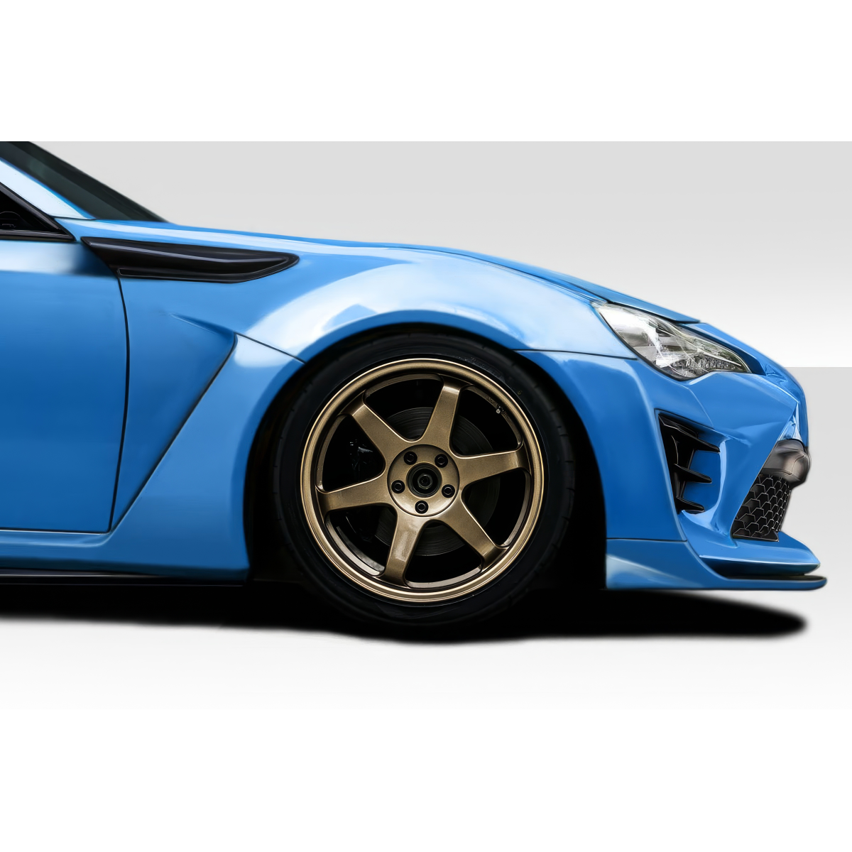 Modify your Toyota 86 2017 with our Exterior/Fenders - Side angle view of a blue Toyota 86