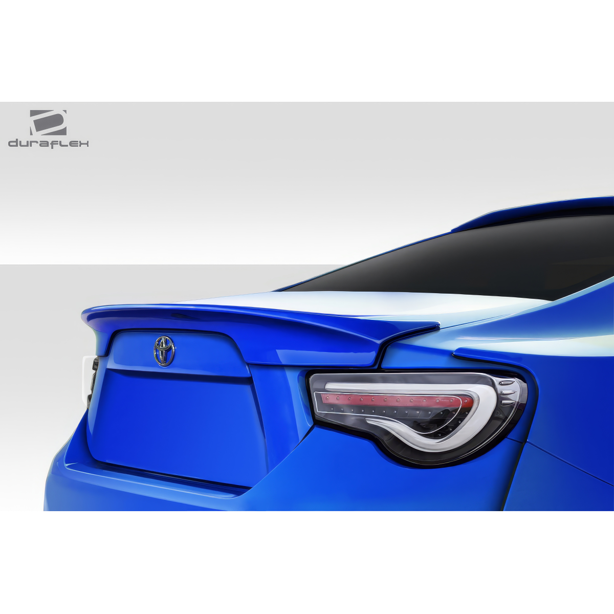 Modify your Subaru BRZ 2013 with our Exterior/Wings - Rear angle view of a blue Subaru BRZ spoiler