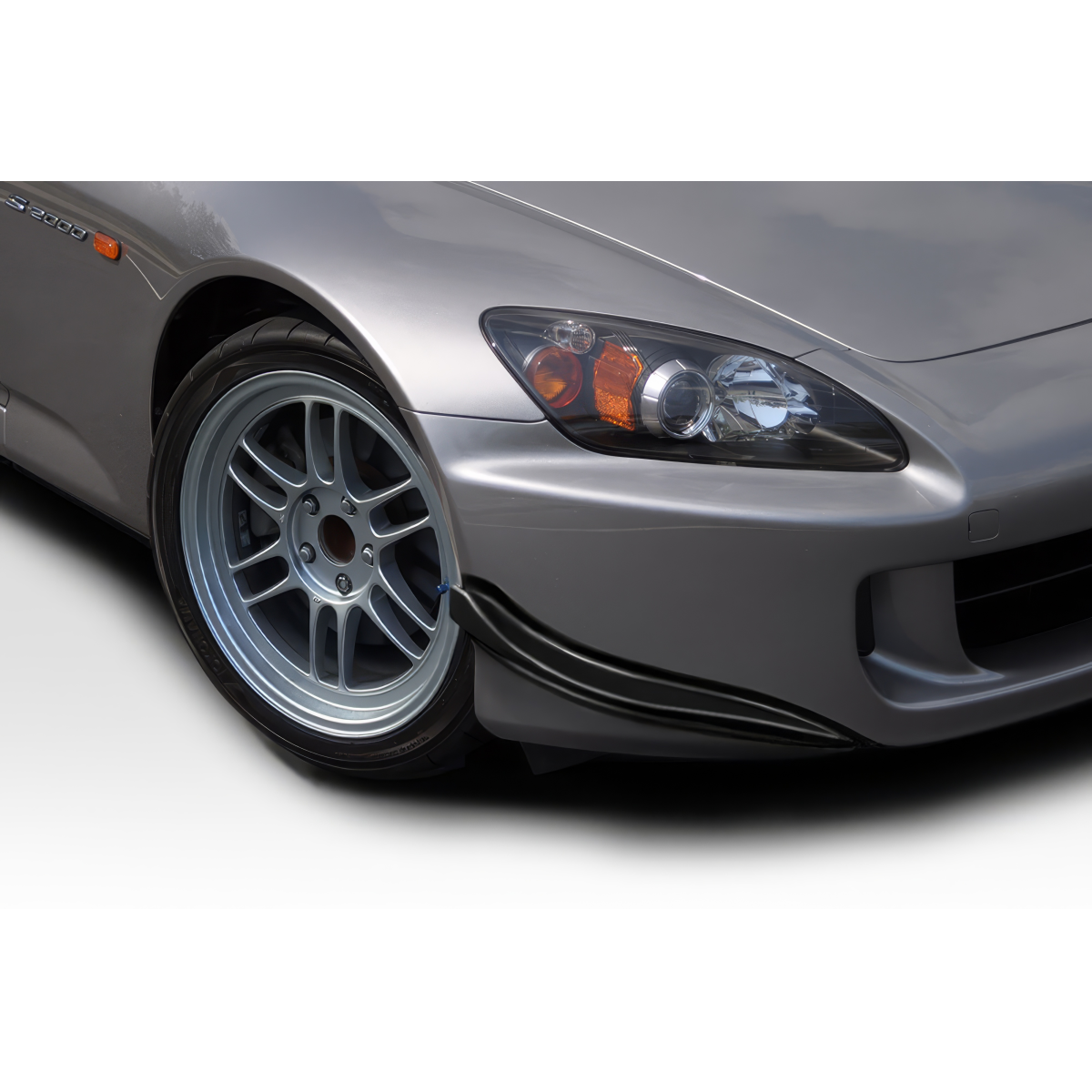 Modify your Honda S2000 2004 with our Exterior/Canards - Angled view showing front wheel and canards