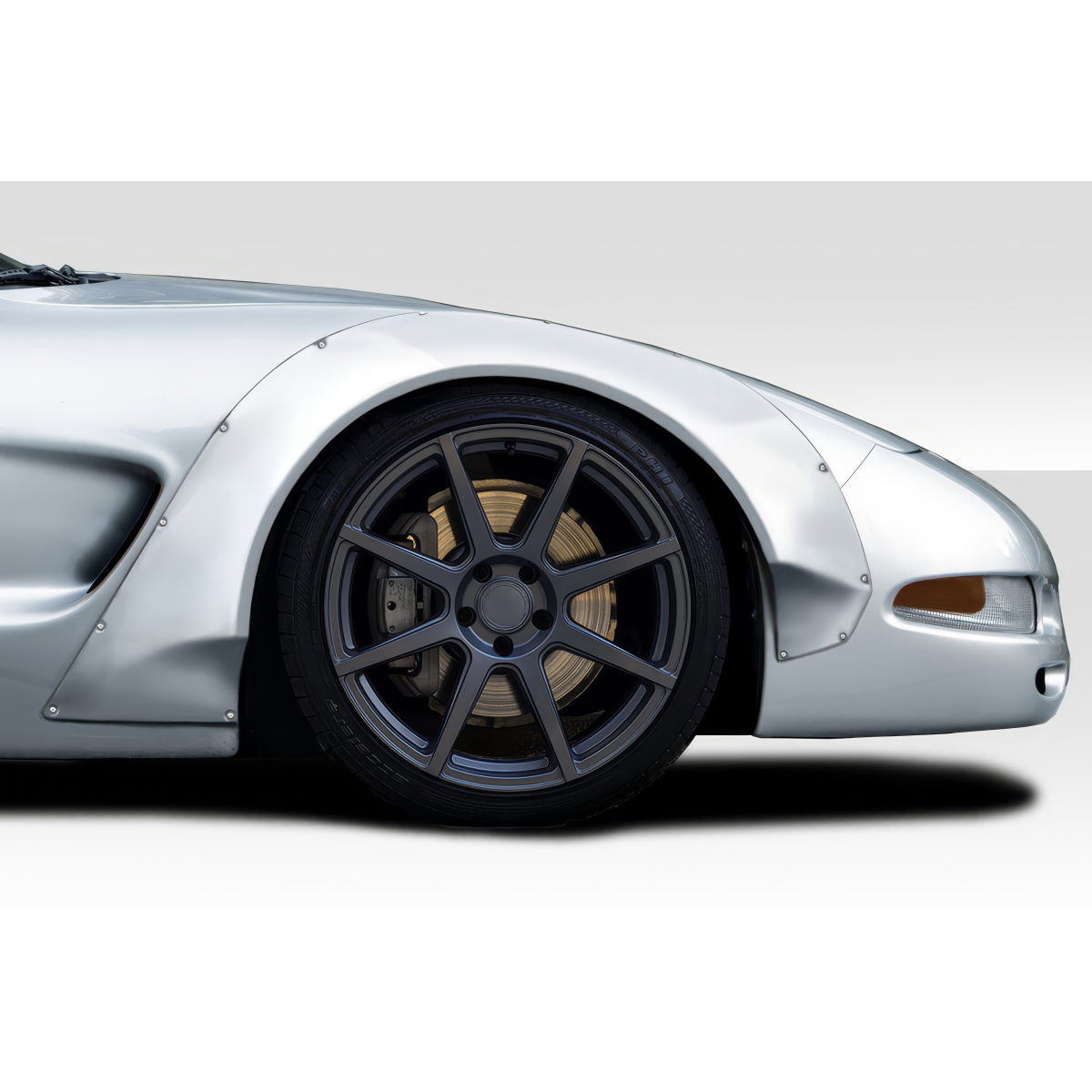 Modify your Chevrolet Corvette 1997 with our Exterior/Fenders - Side angle of front fender with wheel showing