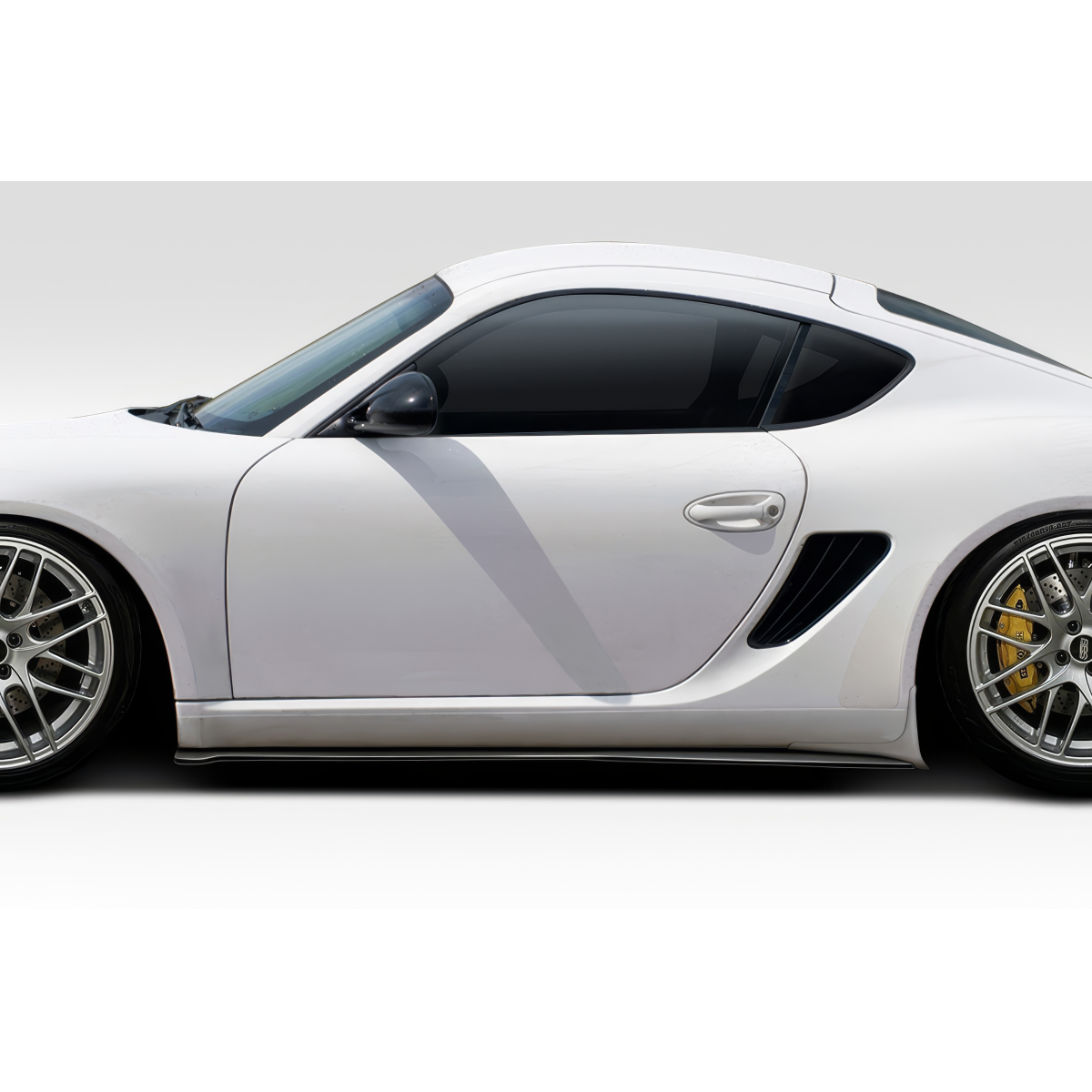 Modify your Porsche Cayman 2006 with our Exterior/Other Exterior - Side view angle of the vehicle displaying splitters