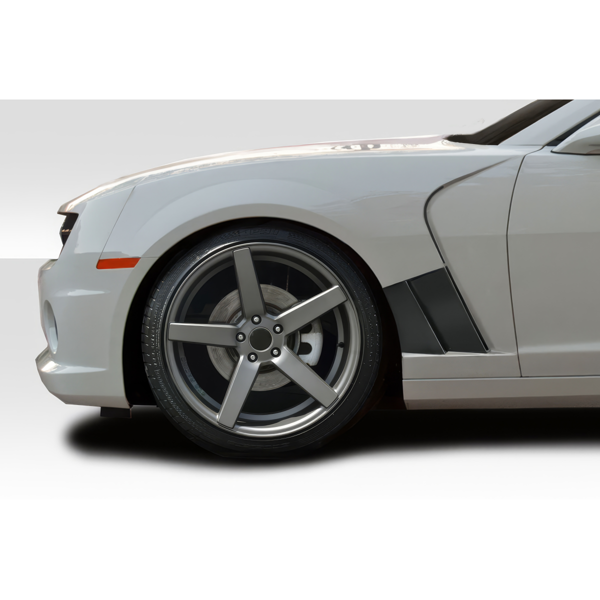 Modify your Chevrolet Camaro 2010 with our Exterior/Fenders - Side view angle of a car fender and wheel