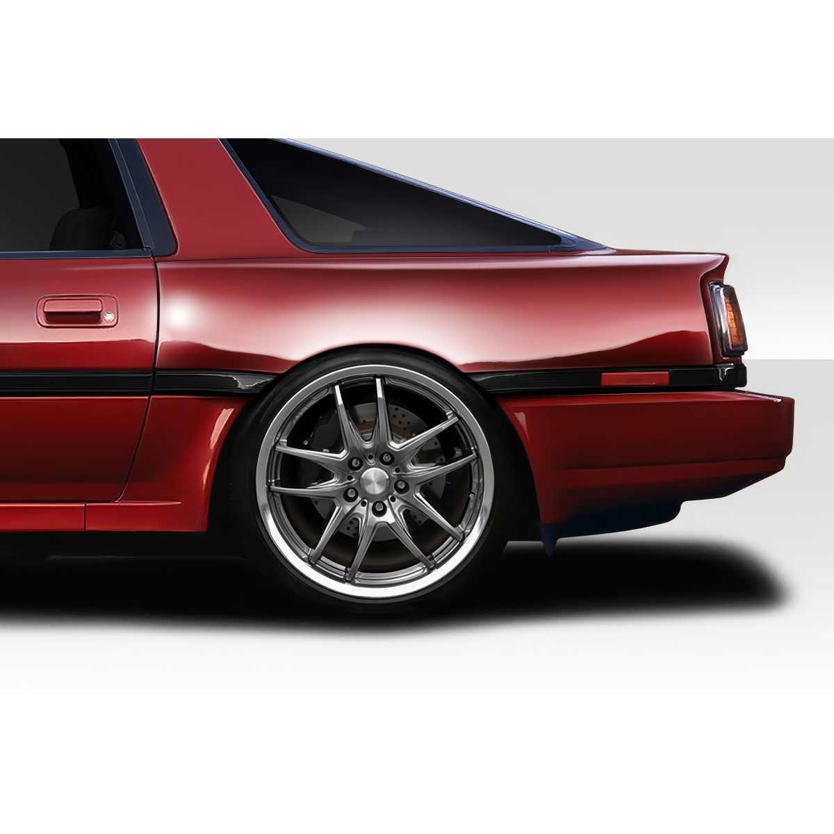 Modify your Toyota Supra 1986 with our Exterior/Fenders - Side angle showcasing rear fender and wheel