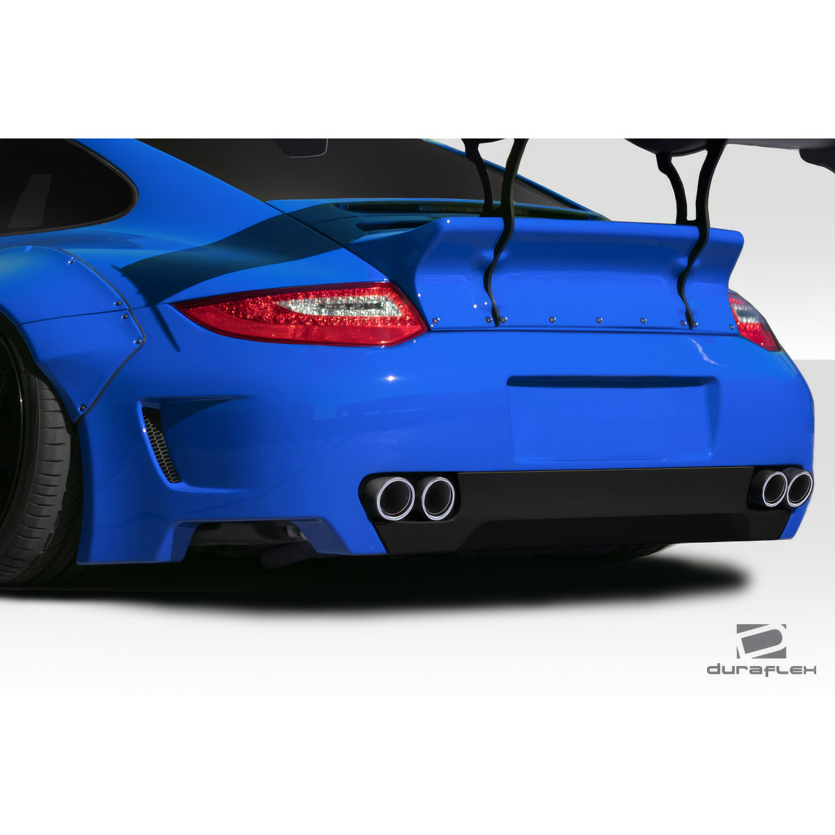 Modify your Porsche 911 2004 with our Exterior/Rear Bumpers or Lips - Rear angle view of a blue Porsche 911