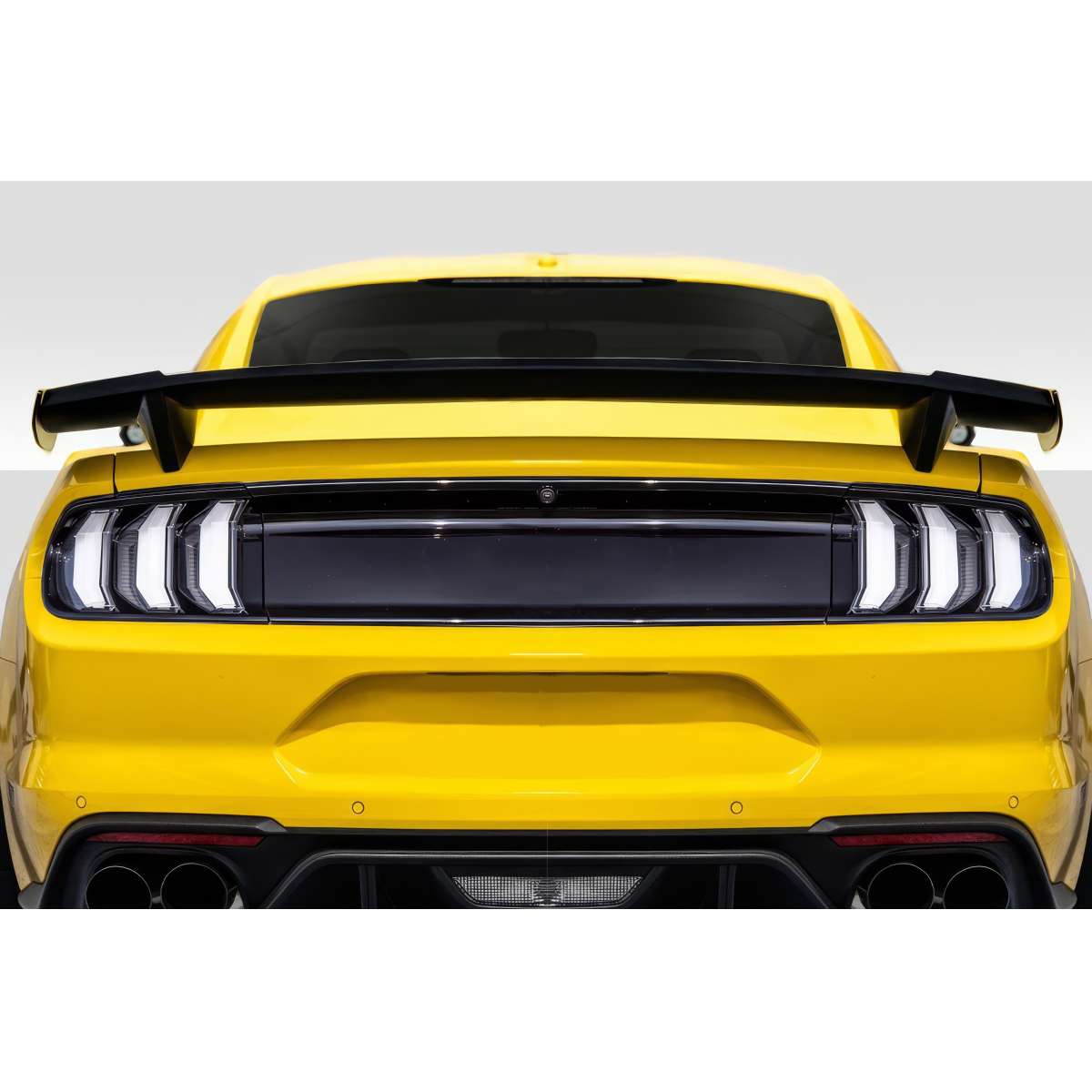 Modify your Ford Mustang 2015 with our Exterior/Wings - Rear view of a yellow Ford Mustang at eye level