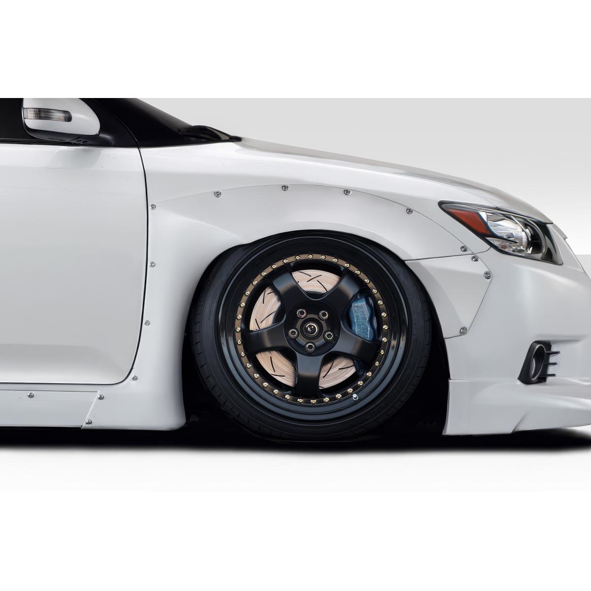 Modify your Scion tC 2011 with our Exterior/Fenders - Side angle of a modified car wheel and fender