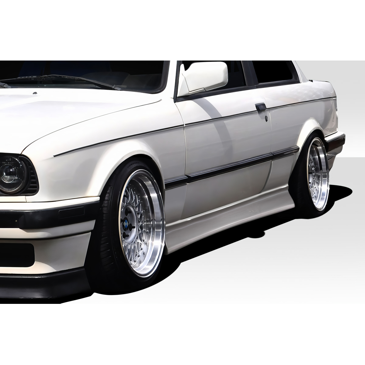 Modify your BMW 3-Series 1984 with our Exterior/Side Skirts - Front quarter angle of vehicle showcasing side skirts