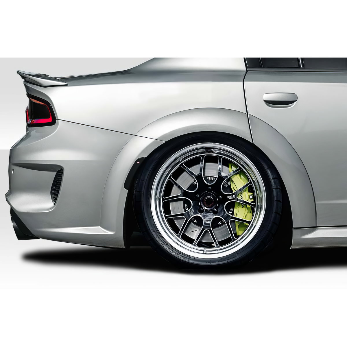 Modify your Dodge Charger 2015 with our Exterior/Fenders - Side angle view of custom fender flares