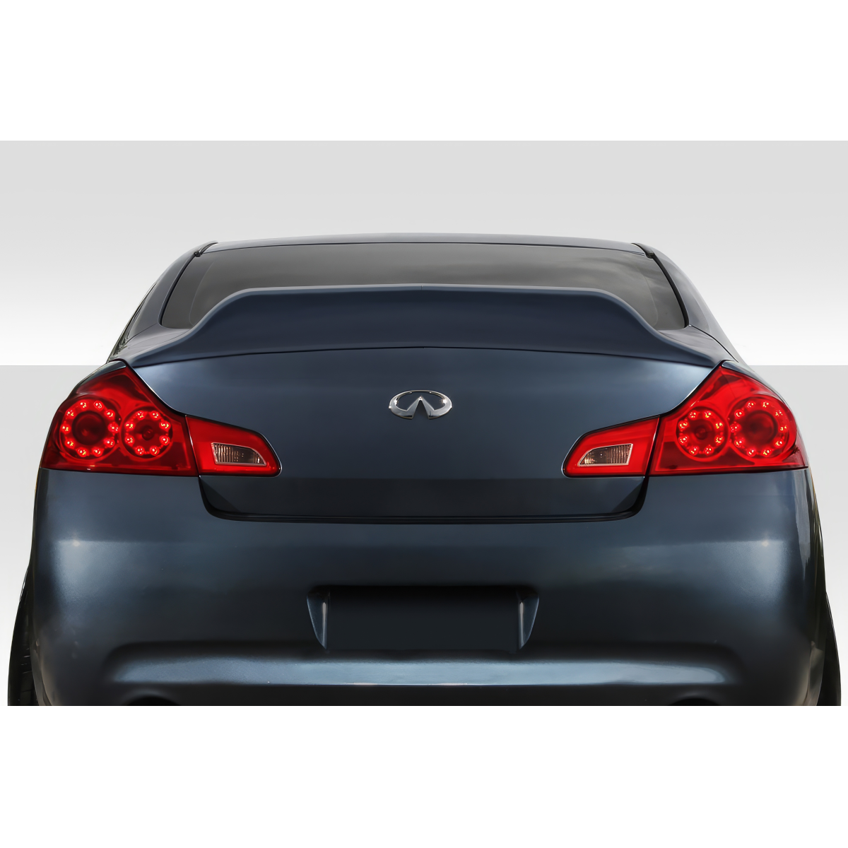 Modify your Infiniti G35 2007 with our Exterior/Wings - Rear view angle of vehicle emphasizes spoiler design