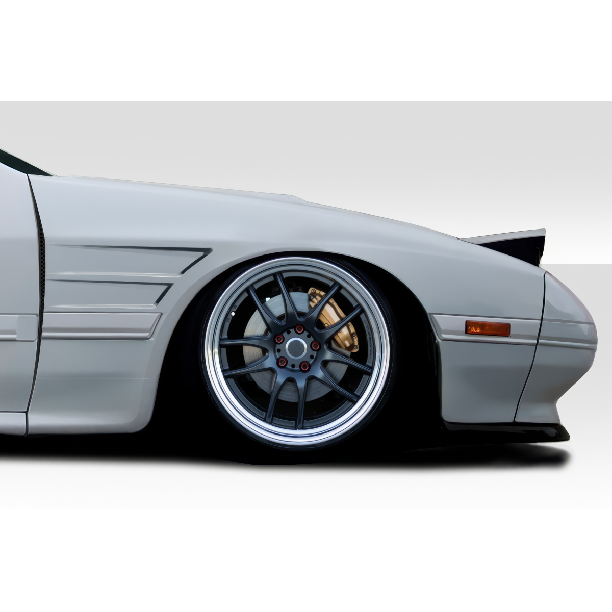 Modify your Mazda RX-7 1986 with our Exterior/Fenders - Side angle of the vehicle focus on fender and wheel