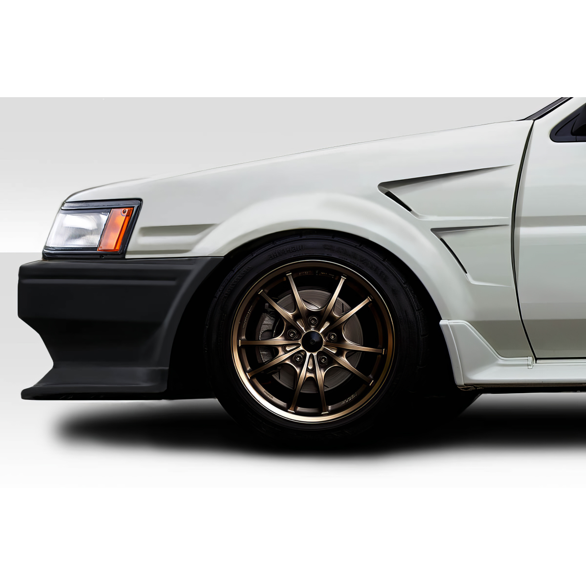 Modify your Toyota Corolla 1984 with our Exterior/Fenders - Side view angle of a modified vehicle fender