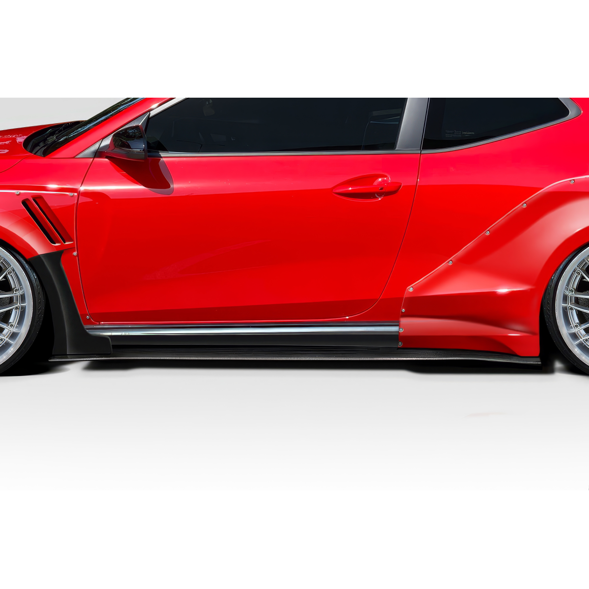 Modify your Hyundai Veloster 2019 with our Exterior/Side Skirts - Side view showcasing the skirts at a low angle