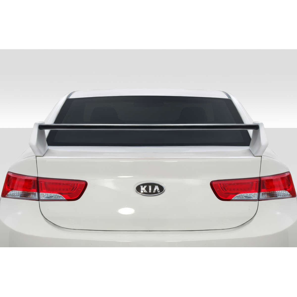 Modify your KIA Forte 2010 with our Exterior/Wings - Rear view angle of vehicle with spoiler visible