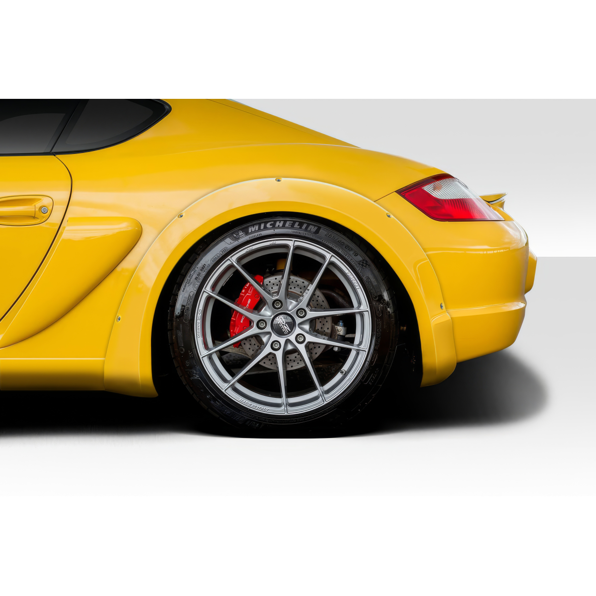 Modify your Porsche Boxster 2006 with our Exterior/Fenders - Rear angle view of yellow Porsche Boxster