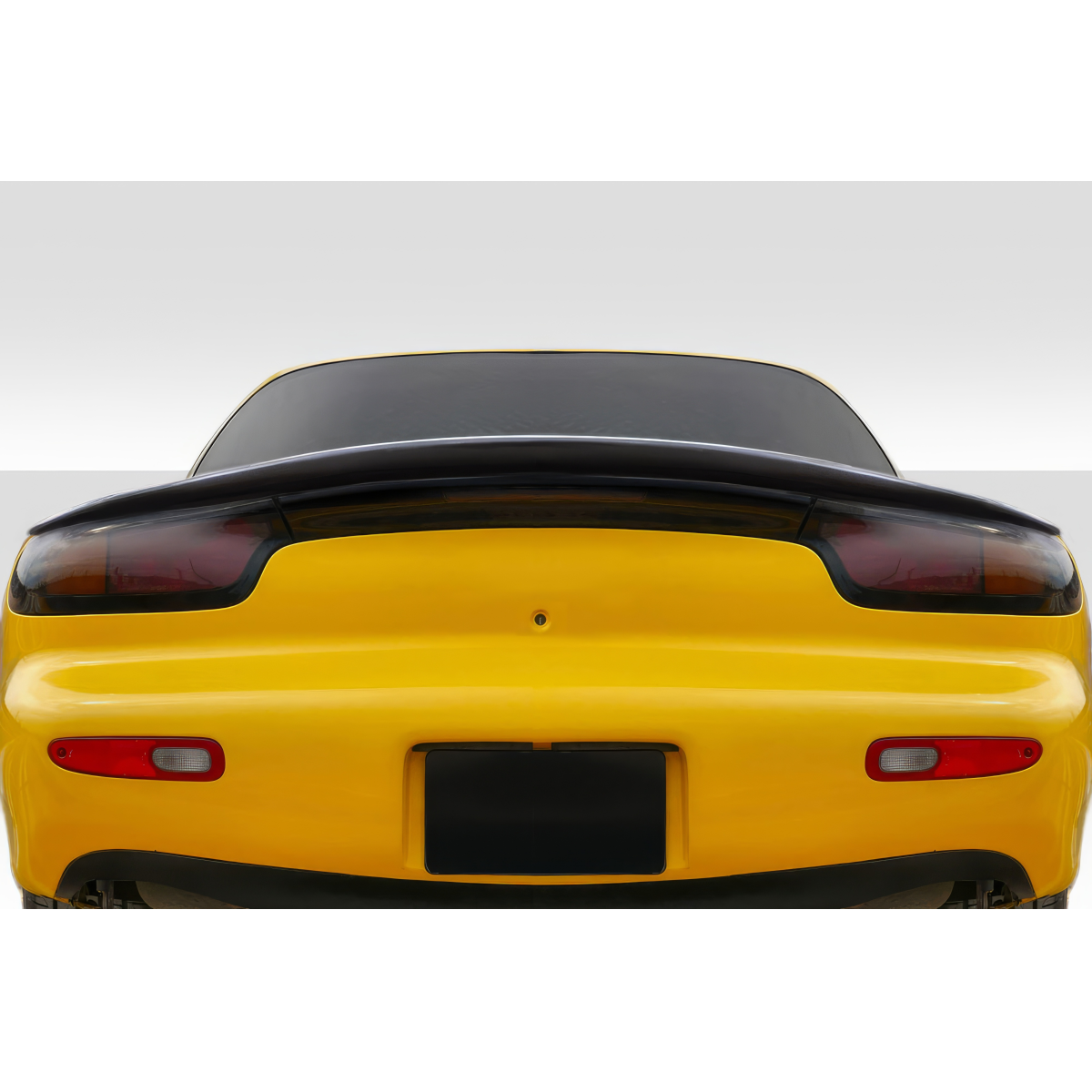 Modify your Mazda RX-7 1993 with our Exterior/Wings - Rear view of the vehicle at a low angle