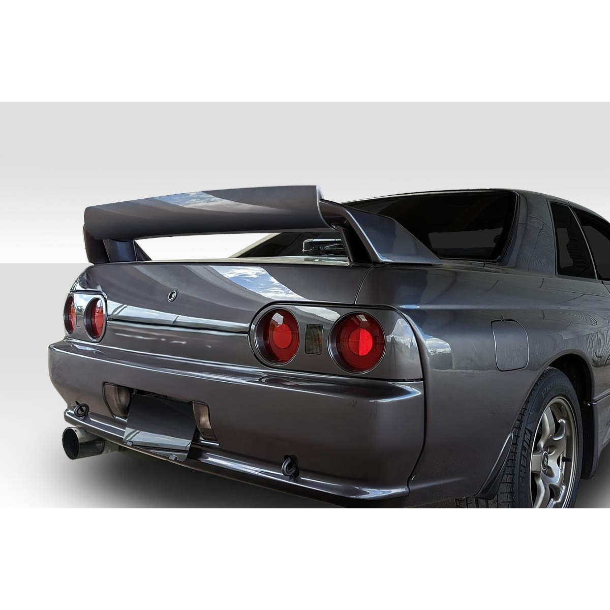 Modify your Nissan Skyline 1989 with our Exterior/Wings - Rear angle view showing rear wing and taillights