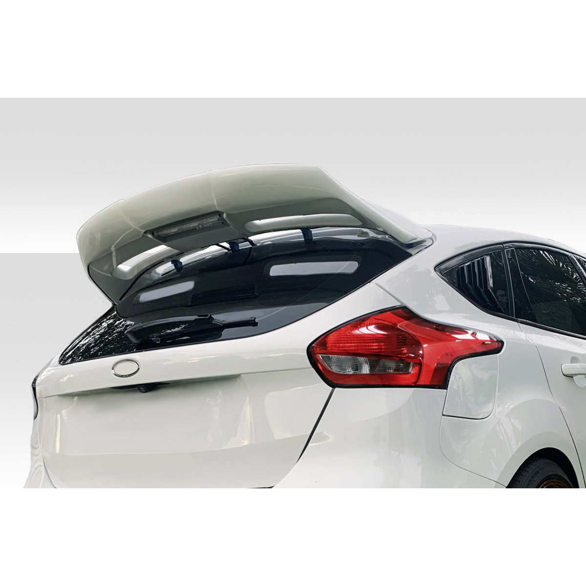 Modify your Ford Focus 2015 with our Exterior/Wings - Rear angle view of the spoiler on the vehicle