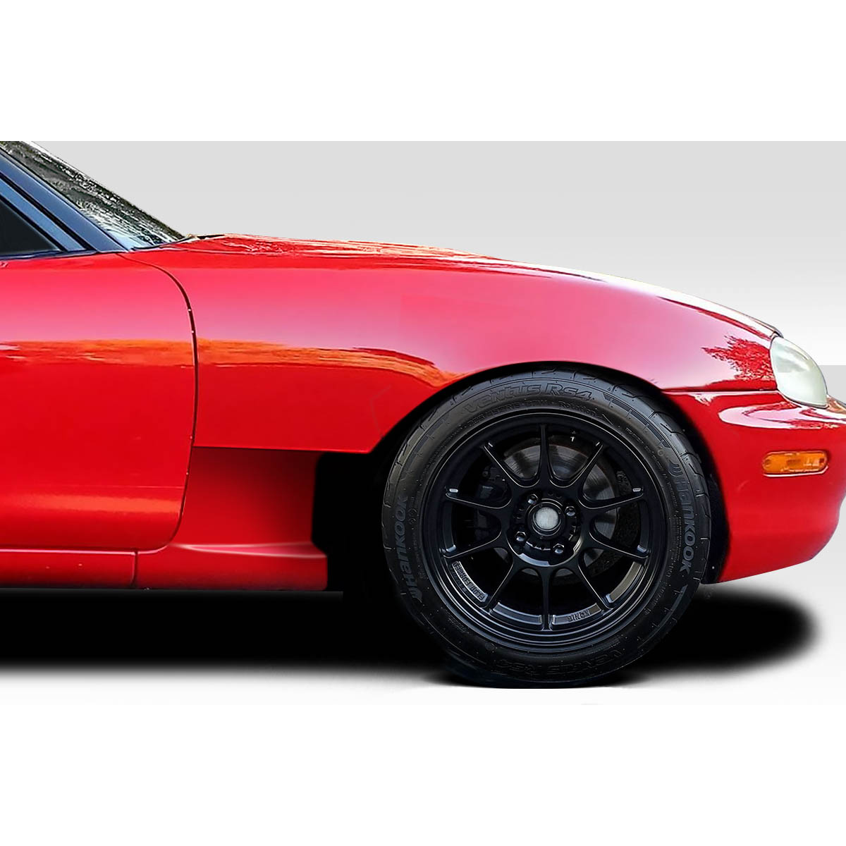 Modify your Mazda Miata 1999 with our Exterior/Fenders - Side angle showcasing fender detail and wheel