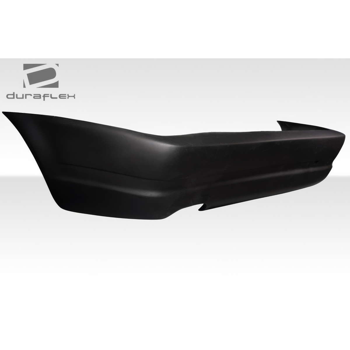 Modify your BMW 3-Series 1999 with our Exterior/Rear Bumpers or Lips - Side view of rear bumper at a slight angle