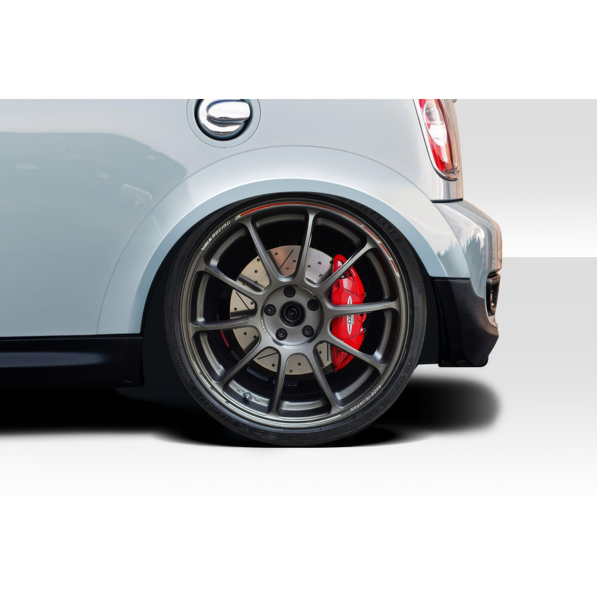 Modify your Mini Cooper 2007 with our Exterior/Fenders - Angled side view showcasing rear wheel and fender
