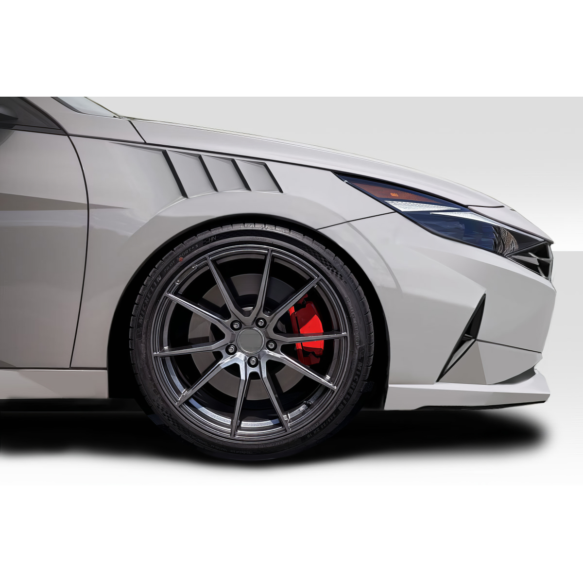 Modify your Hyundai Elantra 2021 with our Exterior/Fenders - Side angle view of the vehicle's fender and wheel