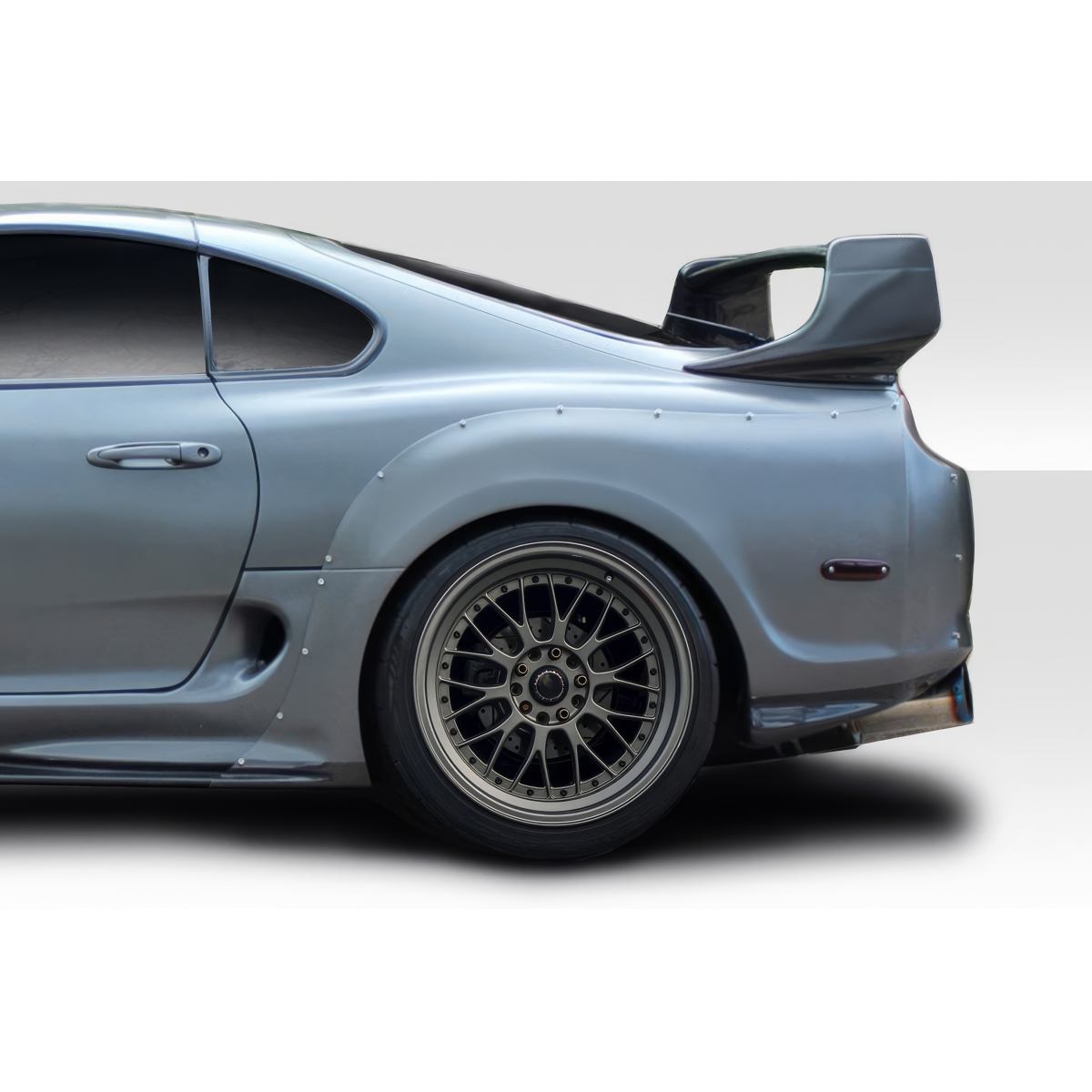 Modify your Toyota Supra 1993 with our Exterior/Fenders - Side view of the rear fender of a car