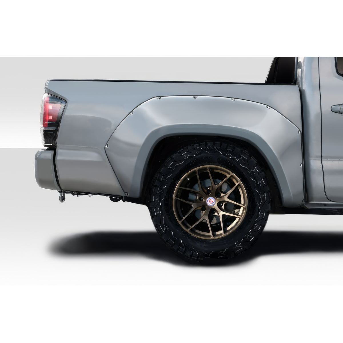 Modify your Toyota Tacoma 2016 with our Exterior/Fenders - Rear angle of vehicle showing fender and wheel