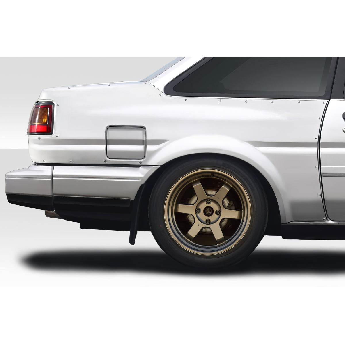 Modify your Toyota Corolla 1984 with our Exterior/Fenders - Angle shows right rear side of vehicle