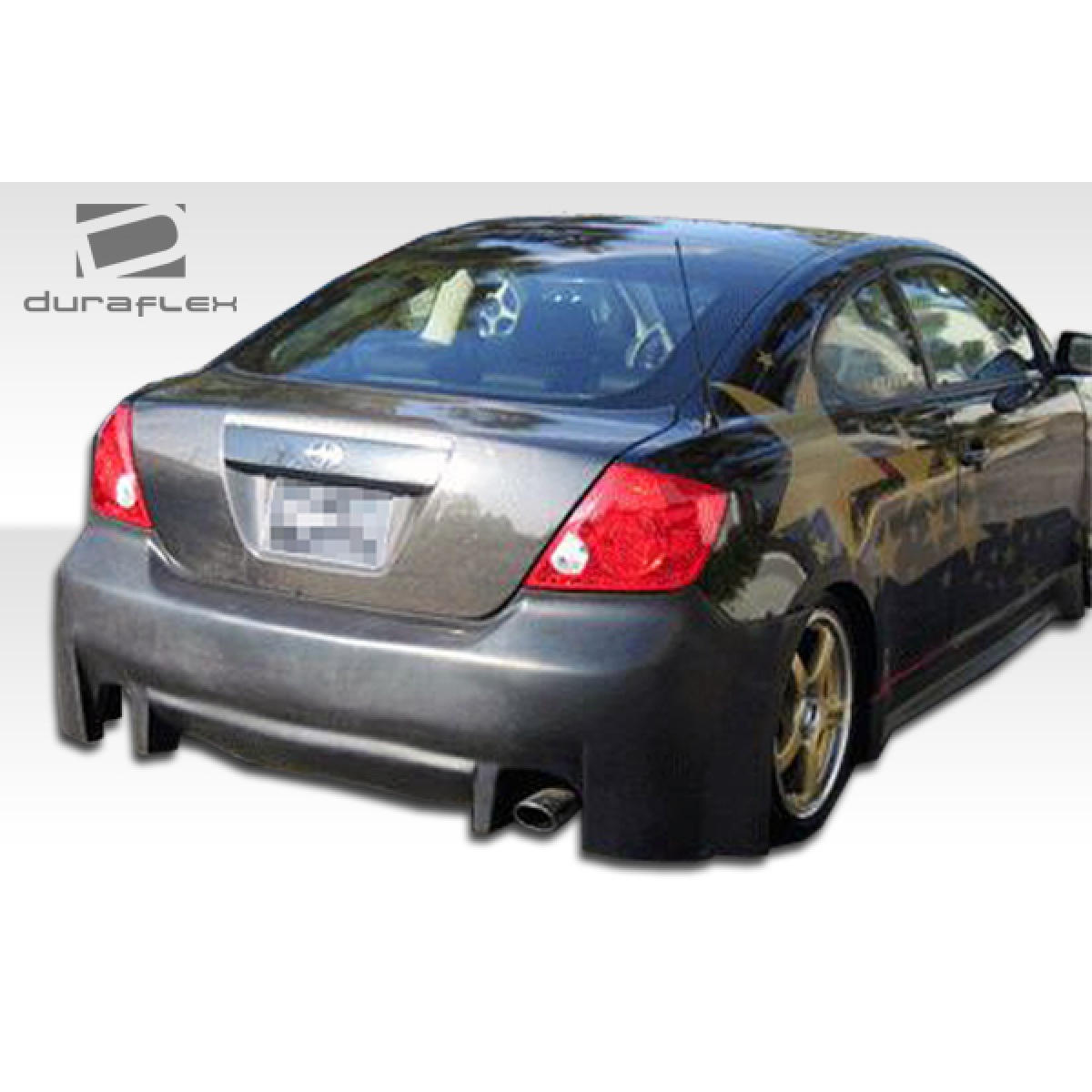 Modify your Scion tC 2005 with our Exterior/Side Skirts - Rear angle of a modified Scion tC car